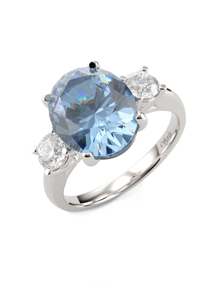 Platinum aquamarine and diamond three stone ring