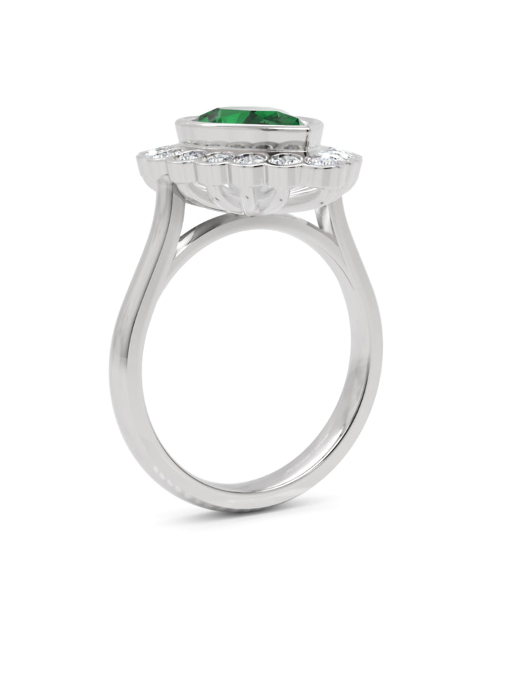Platinum pear shaped emerald & diamond cluster ring