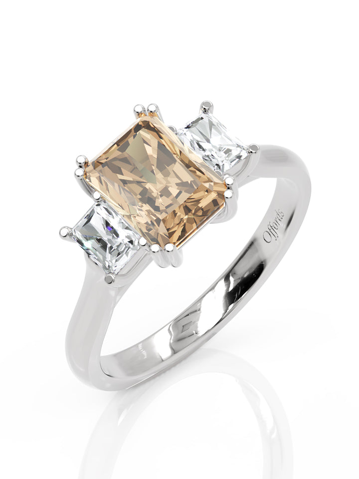 Platinum peach sapphire & diamond three stone ring