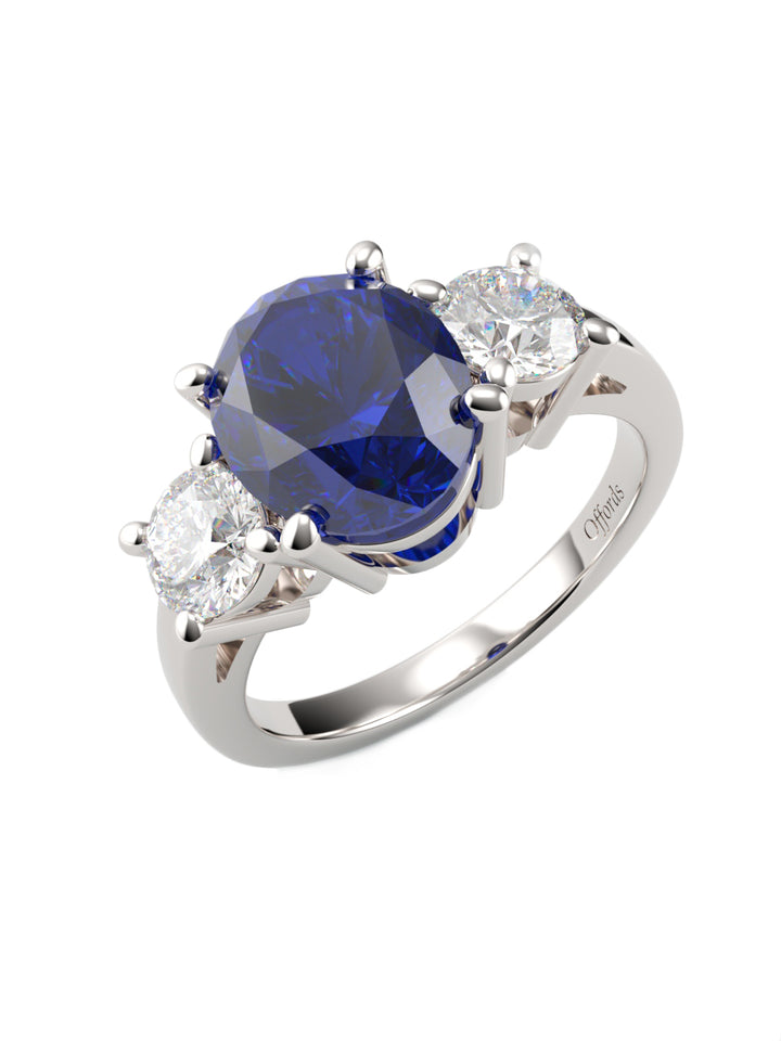 Platinum sapphire & diamond three stone ring