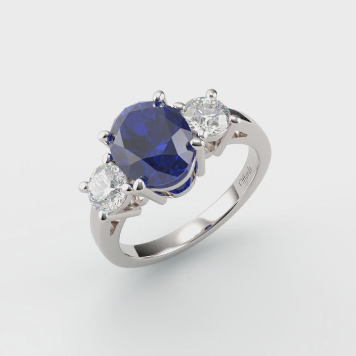 Platinum sapphire & diamond three stone ring