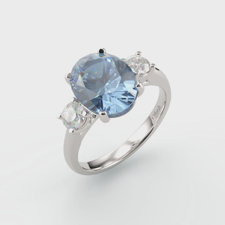 Platinum aquamarine and diamond three stone ring