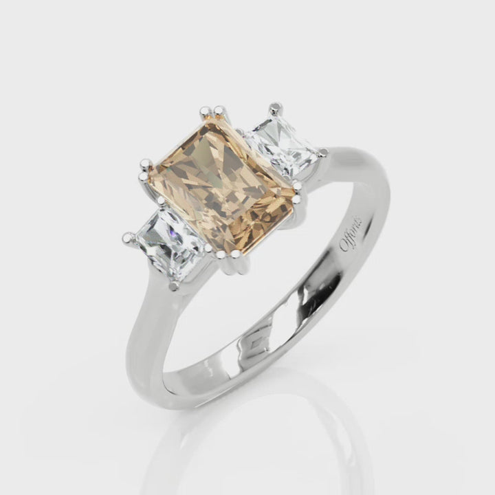 Platinum peach sapphire & diamond three stone ring