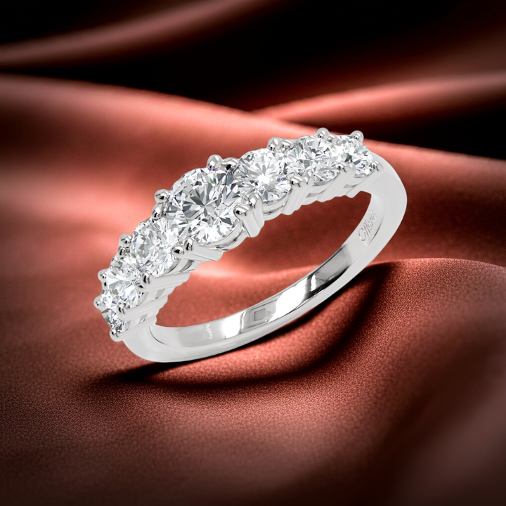 Platinum graduated diamond seven stone ring