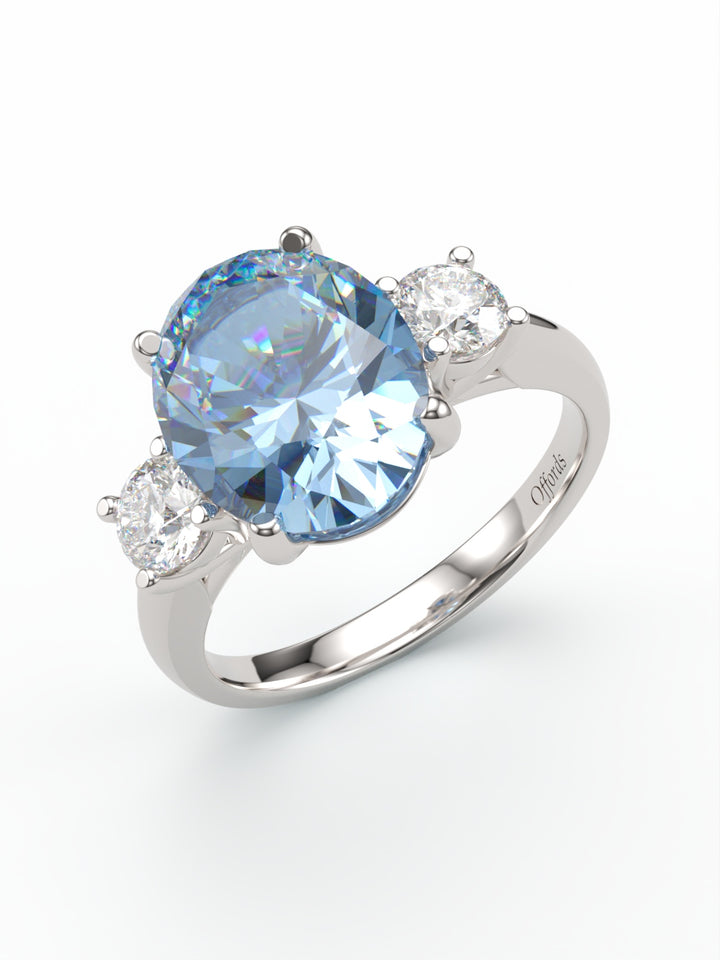 Platinum aquamarine and diamond three stone ring