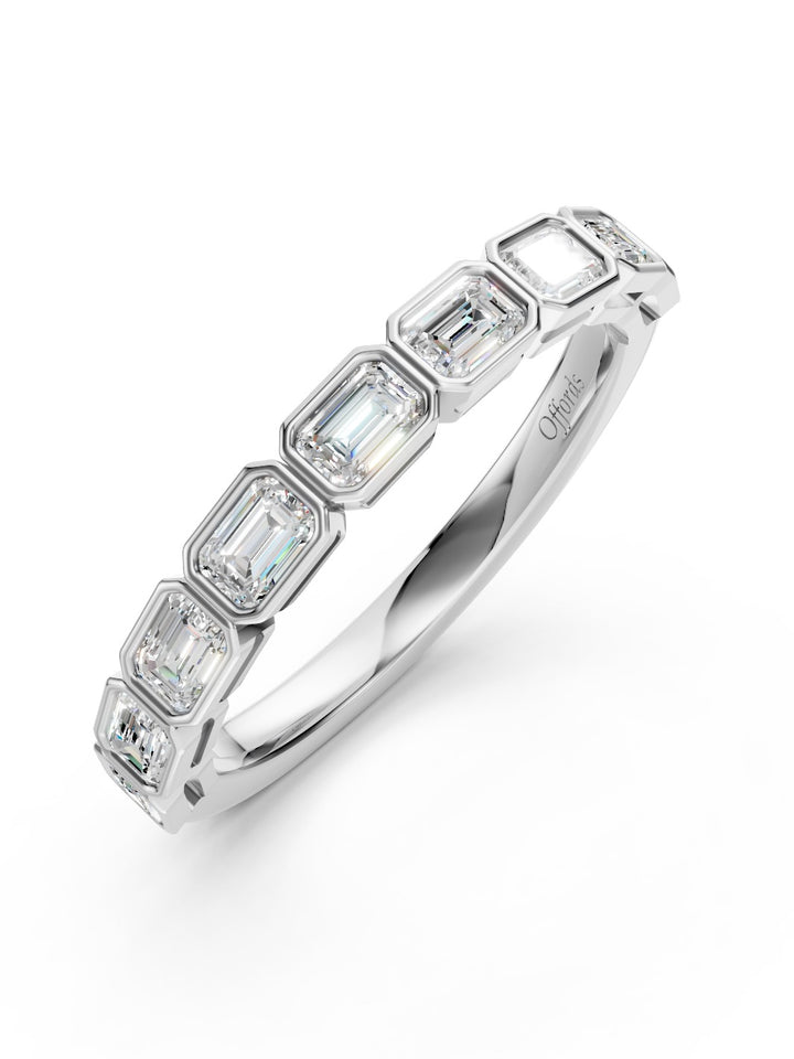 Platinum emerald cut diamond half eternity ring