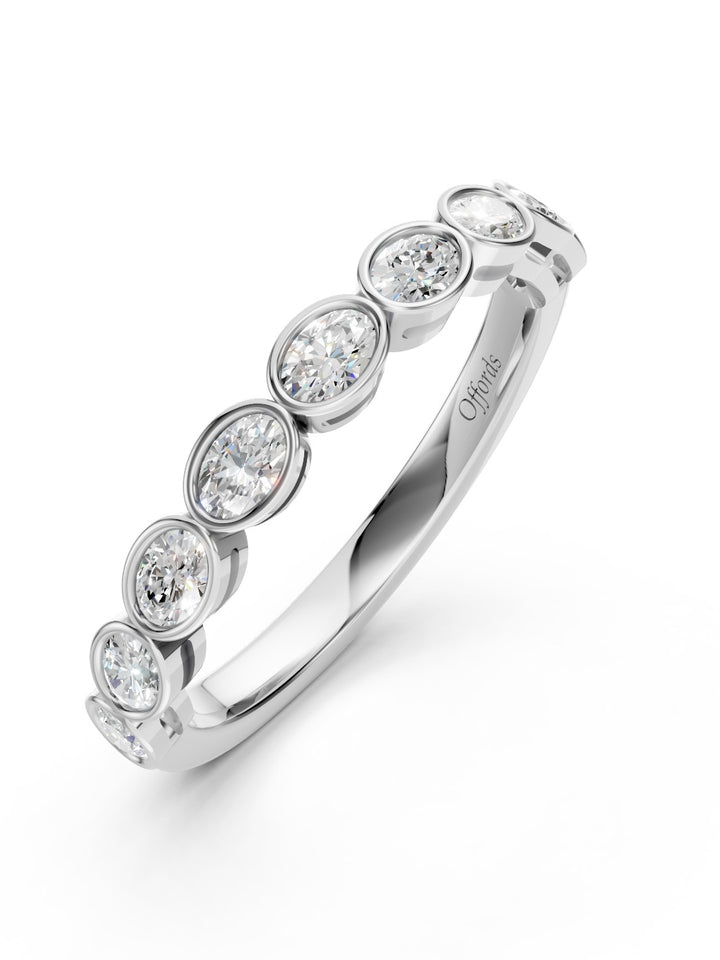 Platinum oval cut diamond bezel set eternity ring - 0.48ct