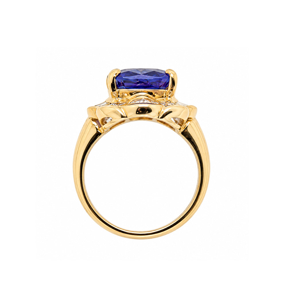 Pre-owned 18ct yellow gold tanzanite cluster ring with baguette cut diamond surround