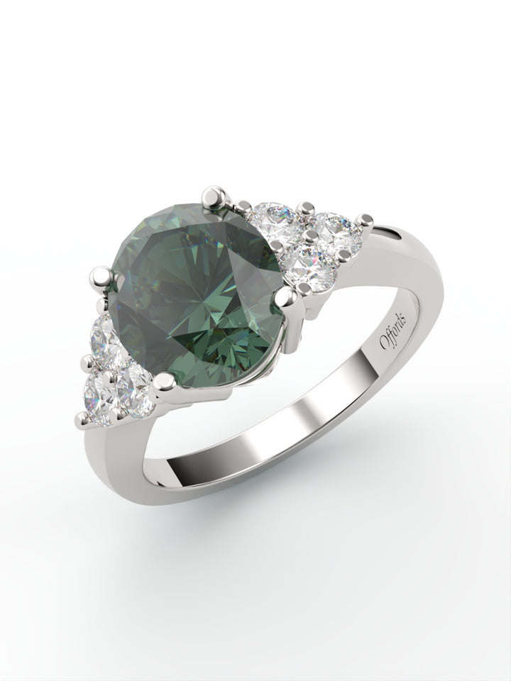 Platinum teal sapphire and diamond 7 stone cluster ring