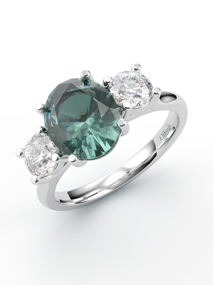 Platinum teal sapphire & diamond three stone ring