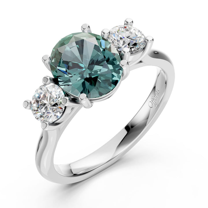 Platinum teal sapphire & diamond three stone ring