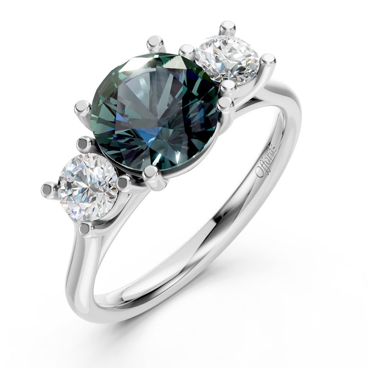 Platinum teal sapphire & diamond three stone ring