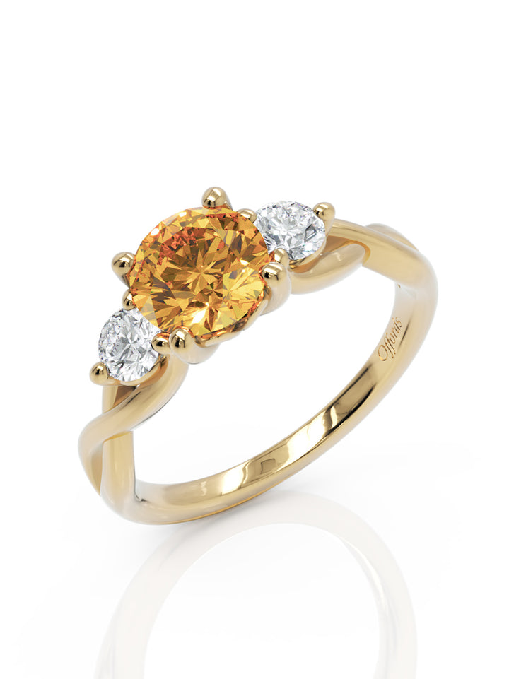 18ct yellow gold, yellow sapphire and diamond three stone ring