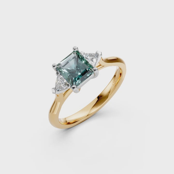 Platinum teal sapphire &amp; diamond three stone ring