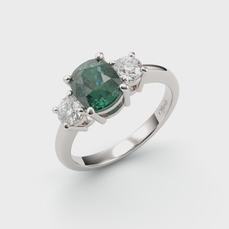Platinum teal sapphire & diamond three stone ring