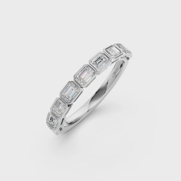 Platinum emerald cut diamond half eternity ring