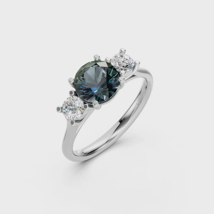 Platinum teal sapphire & diamond three stone ring
