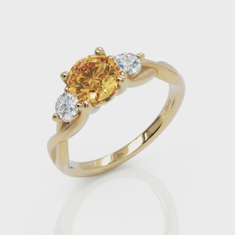18ct yellow gold, yellow sapphire and diamond three stone ring