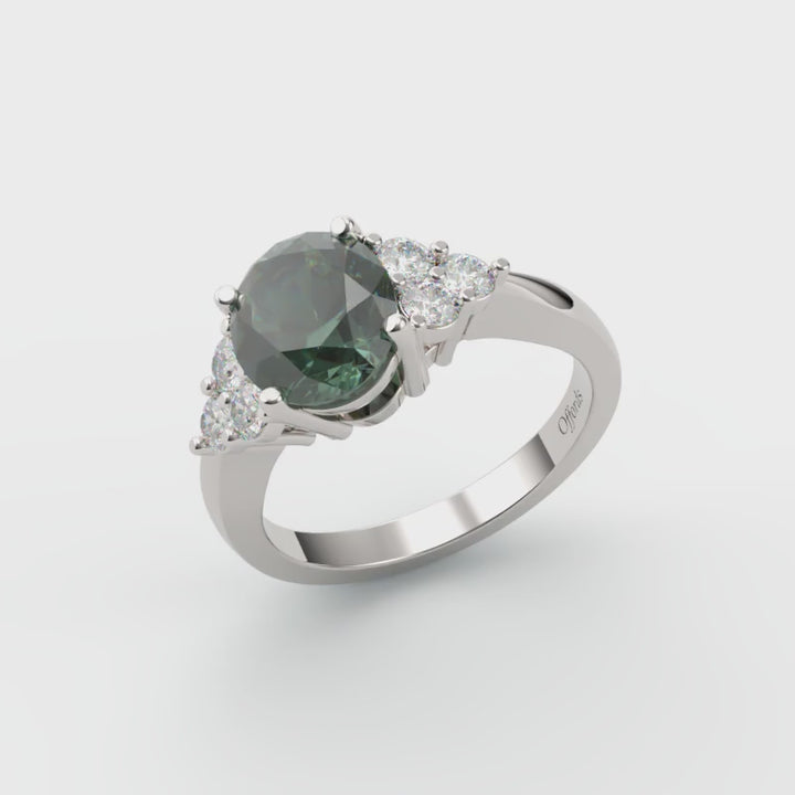 Platinum teal sapphire and diamond 7 stone cluster ring