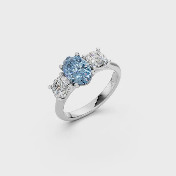 Platinum laboratory grown fancy vivd blue diamond oval three stone ring