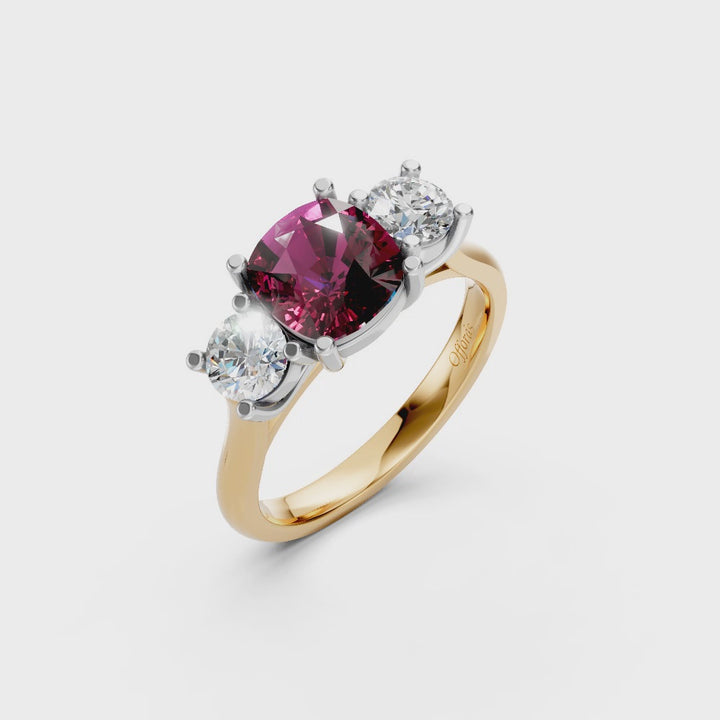 18ct & platinum cushion cut Mozambique ruby and diamond three stone ring