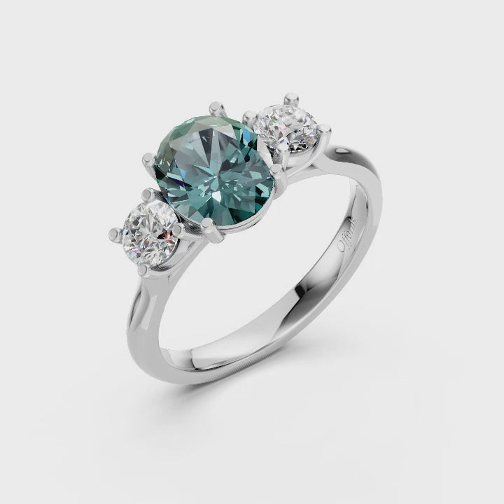 Platinum teal sapphire & diamond three stone ring