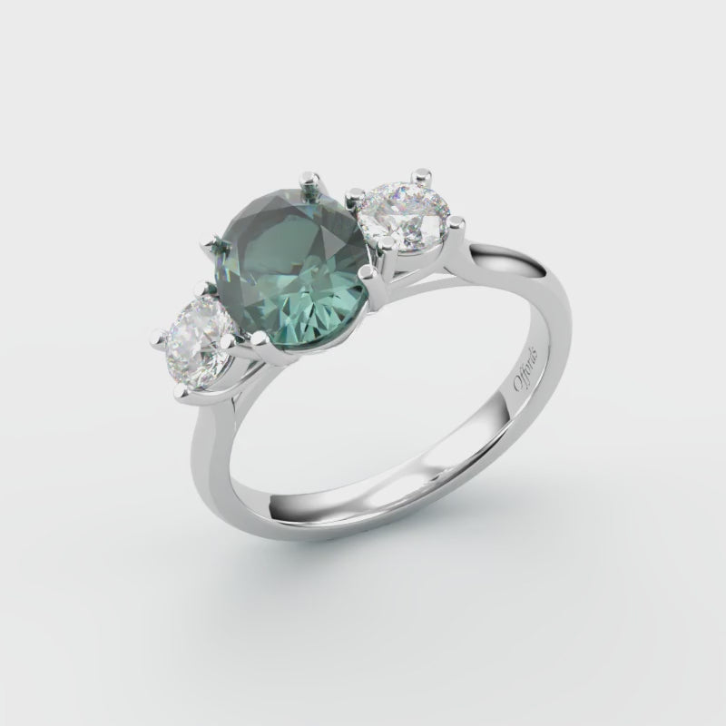 Platinum teal sapphire & diamond three stone ring