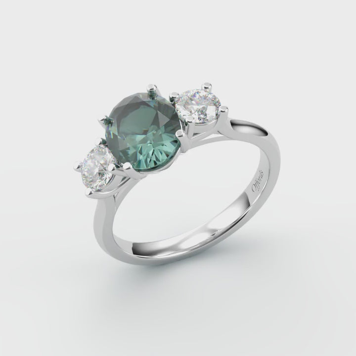 Platinum teal sapphire & diamond three stone ring