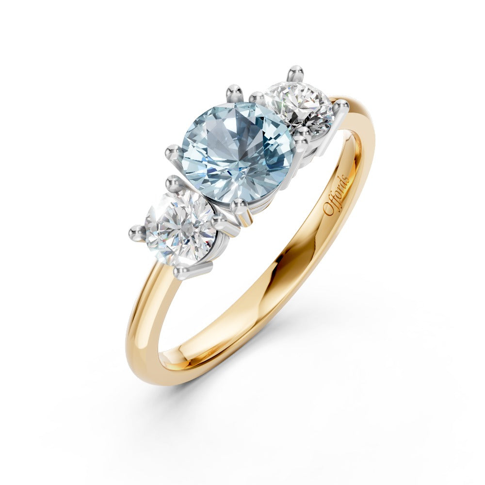 18ct yellow gold and platinum aquamarine and diamond three stone ring